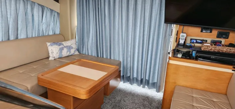 Slide: The Image of Interior of 2013 Azimut 45 Flybridge yacht with seating, table, and entertainment area. - 16