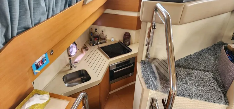 Slide: The Image of Interior of 2013 Azimut 45 Flybridge yacht with compact kitchen and stairs. - 18