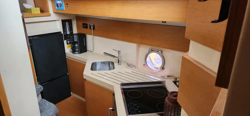 Slide: The Image of Compact kitchen in 2013 Azimut 45 Flybridge yacht with modern amenities and sleek design. - 19