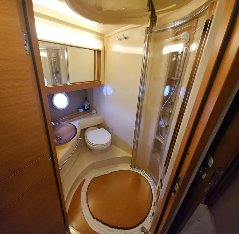 Slide: The Image of Luxurious bathroom in 2013 Azimut 45 Flybridge yacht with shower and porthole. - 25
