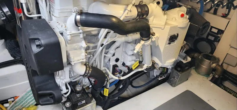 Slide: The Image of Engine room of 2013 Azimut 45 Flybridge yacht, showcasing detailed mechanical components. - 26