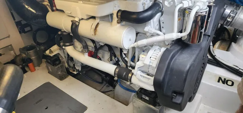 Slide: The Image of Engine room of 2013 Azimut 45 Flybridge yacht, showcasing mechanical components and layout. - 27