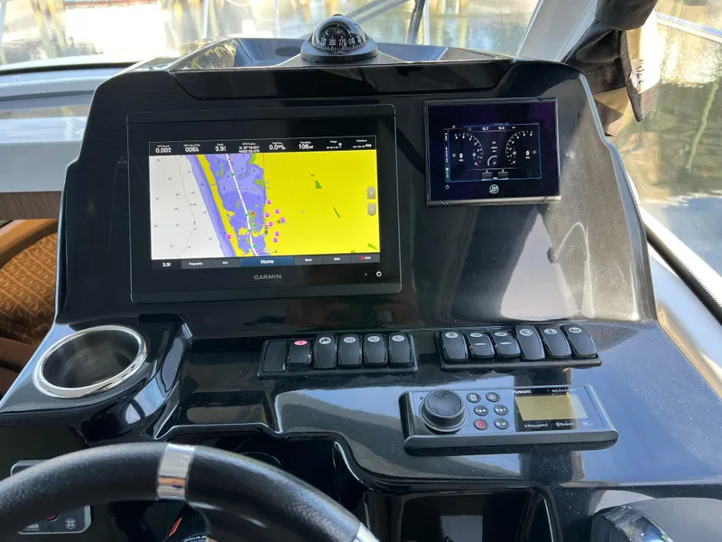 Slide: The Image of Beneteau Antares 9 2021 helm with navigation and control systems. - 12