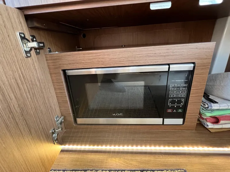 Slide: The Image of Built-in microwave in the 2021 Beneteau Antares 9 yacht kitchen. - 21