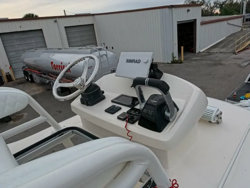 Slide: The Image of Control panel of a 2019 Young Boats 27 with dual Simrad displays. - 11