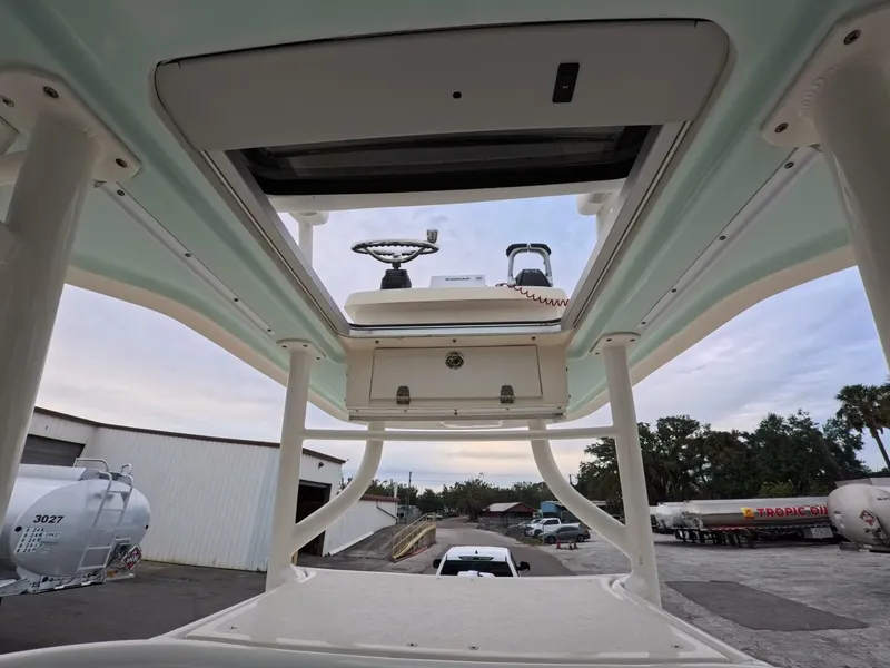 Slide: The Image of Control panel of a 2019 Young Boats 27, featuring various switches and Yamaha controls. - 14