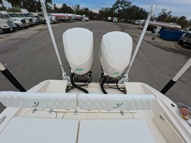 Slide: The Image of 2019 Young Boats 27 model, featuring a spacious deck and modern helm controls. - 27