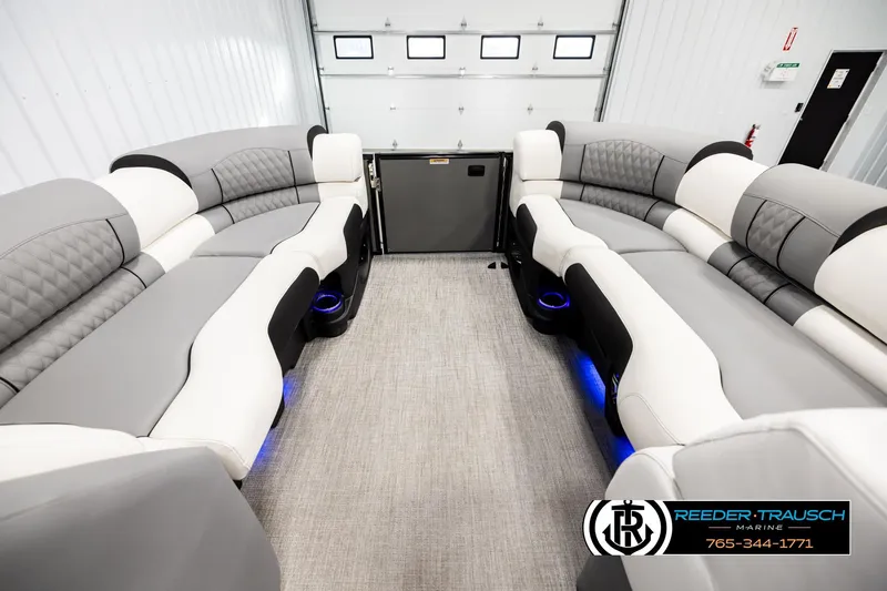 Slide: The Image of Luxurious interior of 2026 Avalon CAT QLS pontoon boat with plush seating and ambient lighting. - 19
