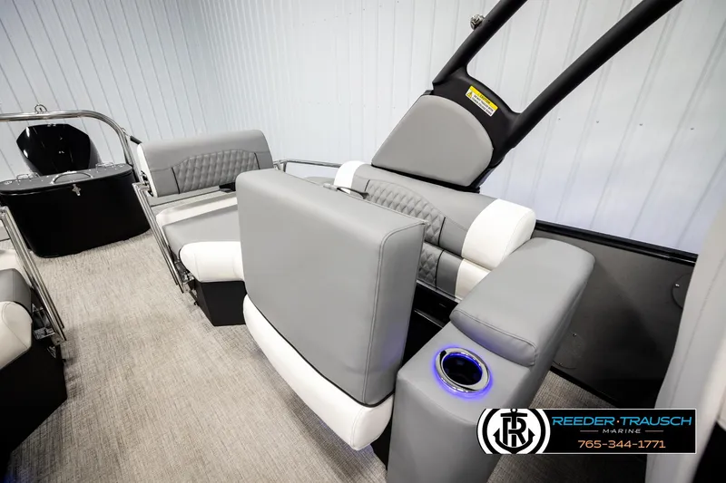 Slide: The Image of 2026 Avalon CAT QLS boat interior with modern gray seating and cup holder. - 23