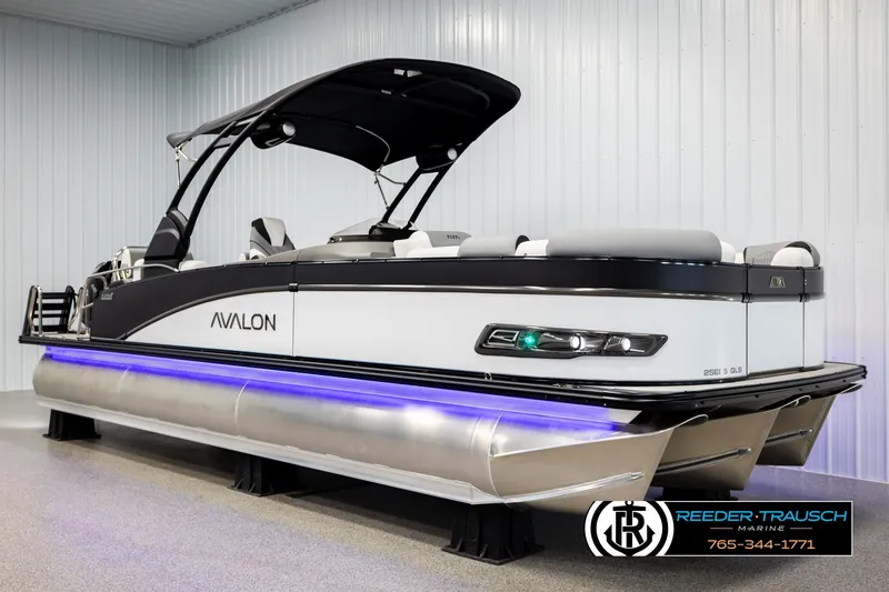 Slide: The Image of 2026 Avalon CAT QLS pontoon boat with sleek design and blue underglow lighting. - 3