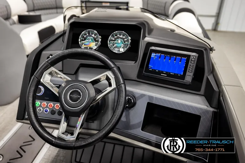 Slide: The Image of Steering console of 2026 Avalon CAT QLS boat with modern controls and display. - 33