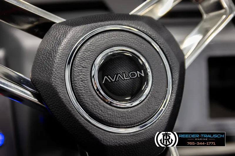 Slide: The Image of Steering wheel of 2026 Avalon CAT QLS with logo, featuring sleek design. - 35