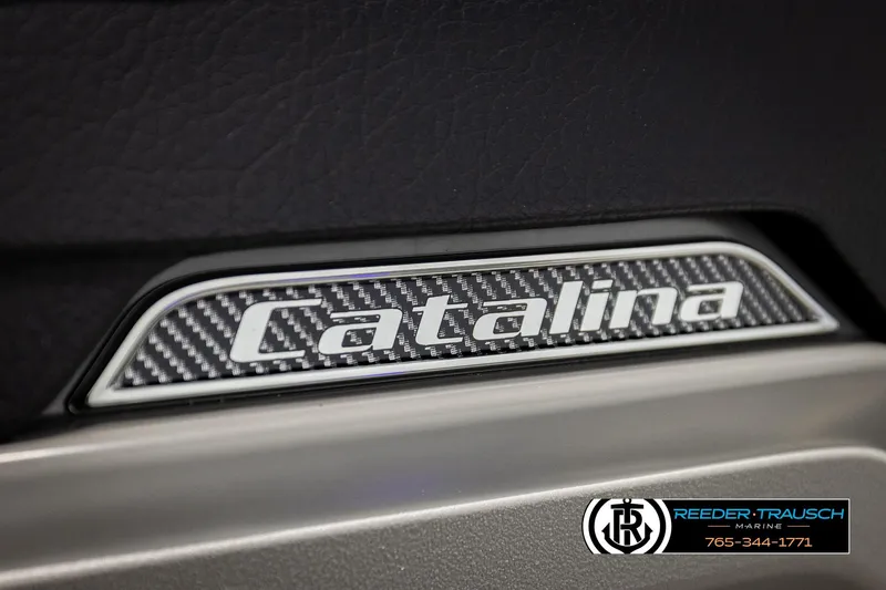 Slide: The Image of Close-up of 2026 Avalon CAT QLS Catalina logo with carbon fiber texture. - 44