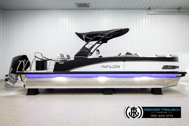Slide: The Image of 2026 Avalon CAT QLS pontoon boat with sleek design and blue underglow lighting. - 5
