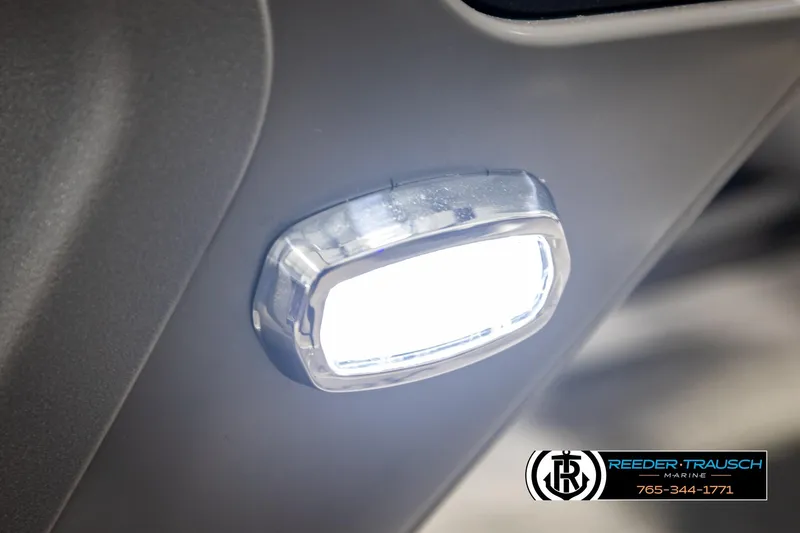 Slide: The Image of Close-up of 2026 Avalon CAT QLS boat light, illuminated, with Reeder-Trausch Marine logo. - 51