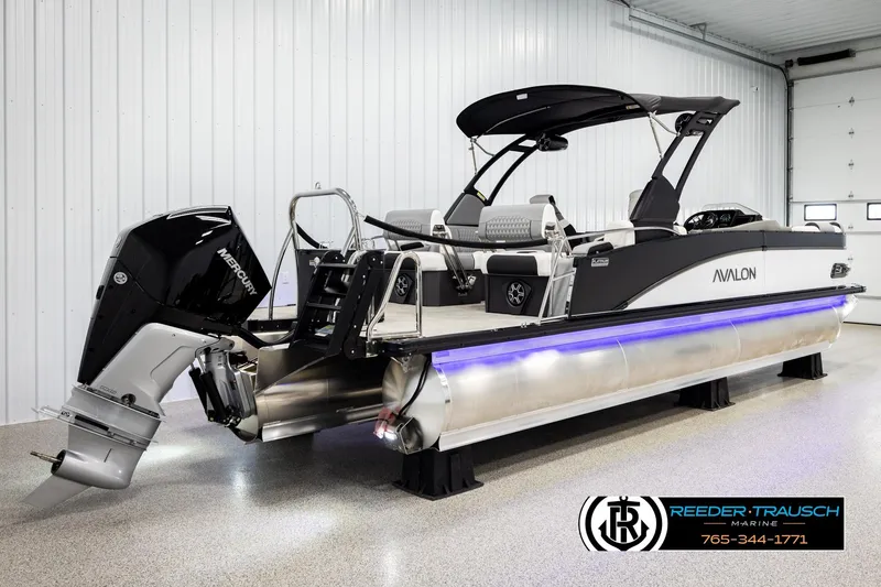 Slide: The Image of 2026 Avalon CAT QLS pontoon boat with Mercury engine in showroom. - 6