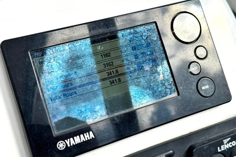 Slide: The Image of Yamaha display on 2016 Edgewater 205CX Crossover boat showing trip data and engine hours. - 5