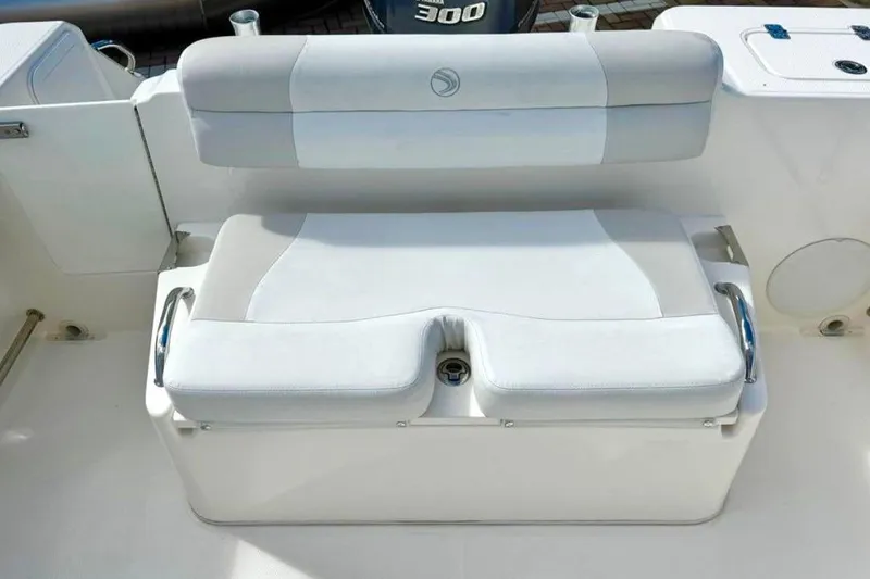 Slide: The Image of White cushioned seating on 2016 Edgewater 205CX Crossover boat, featuring sleek design and comfort. - 14