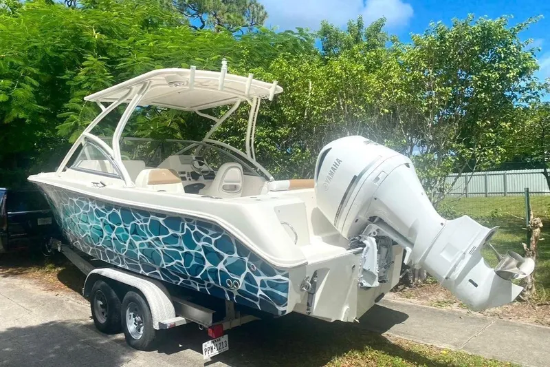 Slide: The Image of 2016 Edgewater 205CX Crossover boat with Yamaha outboard motor on trailer. - 4