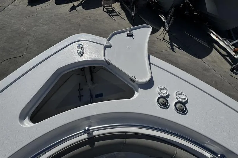 Slide: The Image of 2026 Sportsman Open 252 Center Console boat deck with open storage compartment. - 10