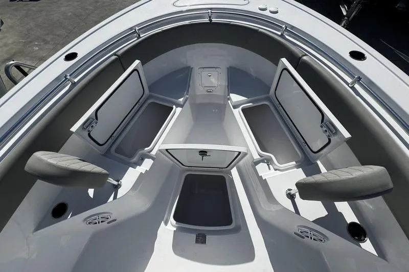 Slide: The Image of 2026 Sportsman Open 252 Center Console boat interior with open storage compartments. - 11