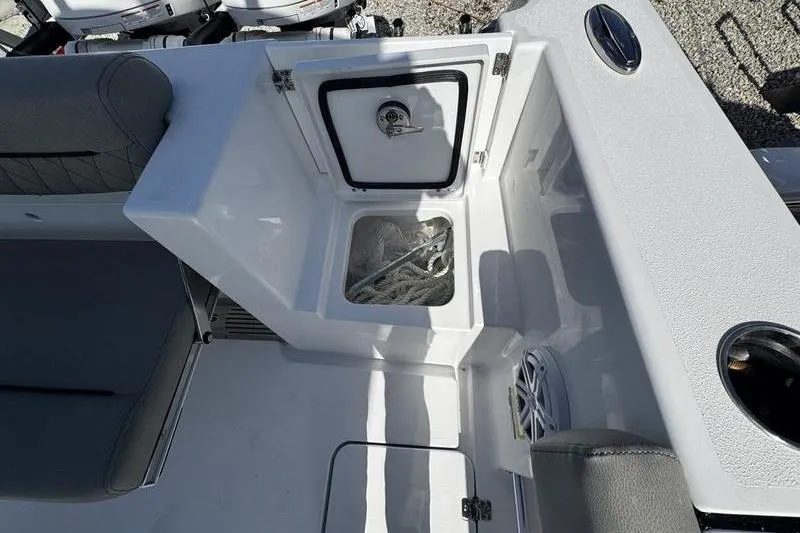 Slide: The Image of 2026 Sportsman Open 252 Center Console boat interior with storage compartment. - 28
