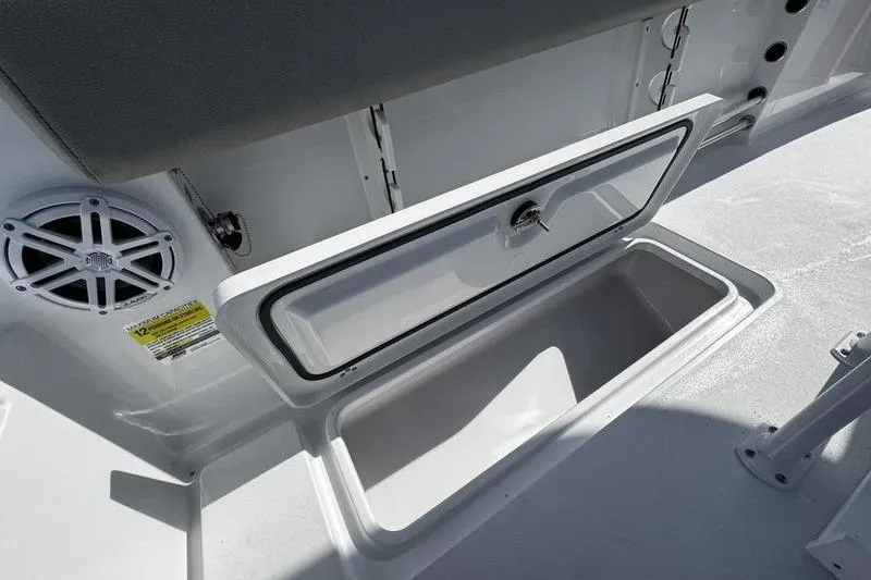Slide: The Image of Open storage compartment on 2026 Sportsman Open 252 Center Console boat. - 29
