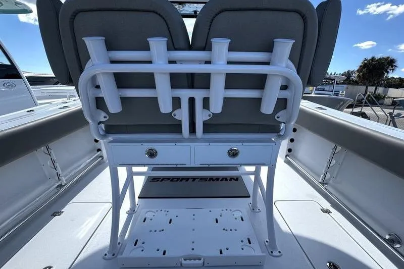 Slide: The Image of 2026 Sportsman Open 252 Center Console boat interior with rod holders and seating. - 30