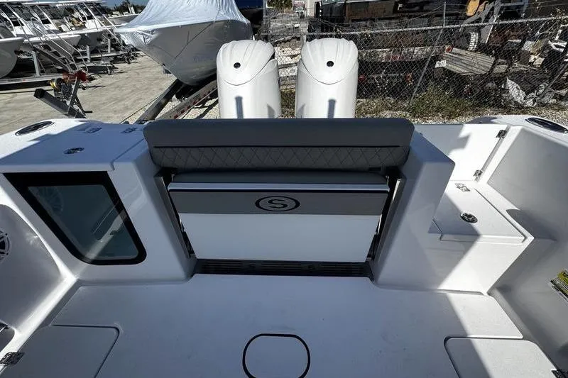 Slide: The Image of 2026 Sportsman Open 252 Center Console boat interior with dual engines. - 32