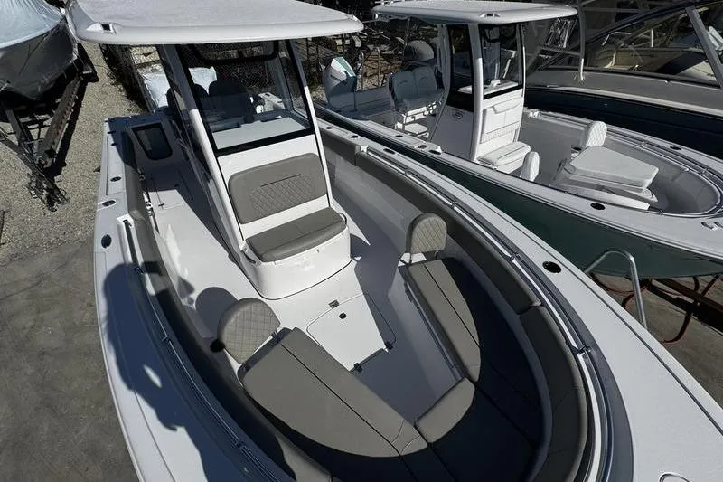 Slide: The Image of 2026 Sportsman Open 252 Center Console boat with sleek seating and modern design. - 7