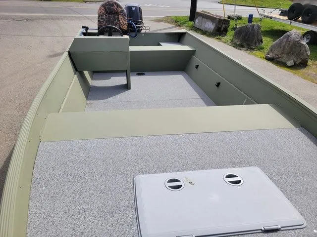 Slide: The Image of Klamath 16' Double JAC boat 2023 on parking lot, gray and green interior. - 10