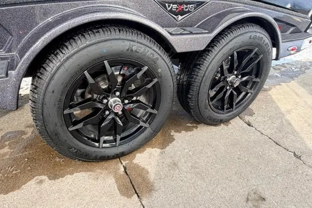 Slide: The Image of 2026 Vexus DVX22 trailer with black alloy wheels on a concrete surface. - 15