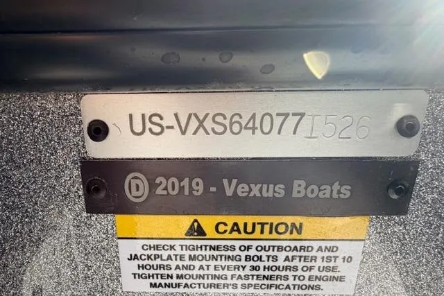 Slide: The Image of Hull identification number on a Vexus DVX22 boat, model year 2026, with caution label. - 4