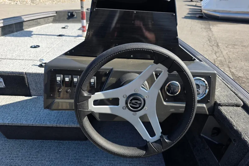 Slide: The Image of Steering console of 2026 Smoker Craft Viper 165 boat with modern controls. - 12
