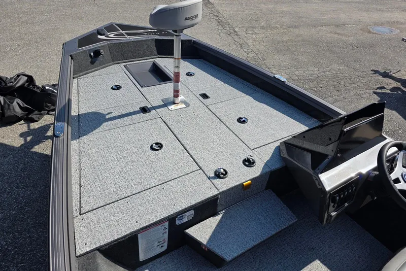 Slide: The Image of 2026 Smoker Craft Viper 165 boat interior with seating and storage compartments. - 7