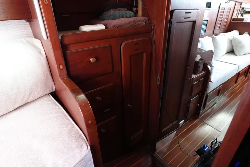Slide: The Image of 1978 Morgan 382 yacht interior with wooden cabinetry and cozy seating area. - 18