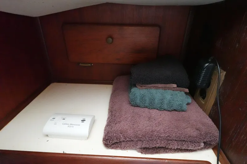 Slide: The Image of Towels and carbon monoxide alarm in 1978 Morgan 382 boat cabin storage. - 21
