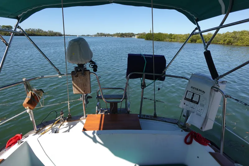 Slide: The Image of Cockpit view from a 1978 Morgan 382 sailboat on a calm lake. - 4