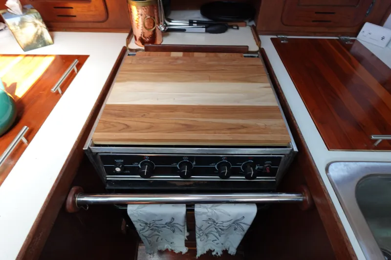 Slide: The Image of 1978 Morgan 382 yacht kitchen with wooden countertop and stove. - 56