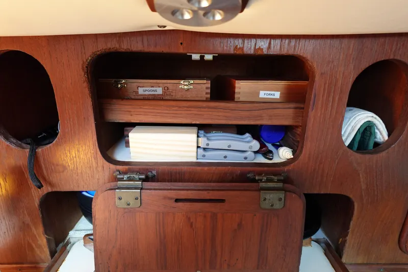 Slide: The Image of 1978 Morgan 382 yacht interior storage with labeled utensil compartments. - 61