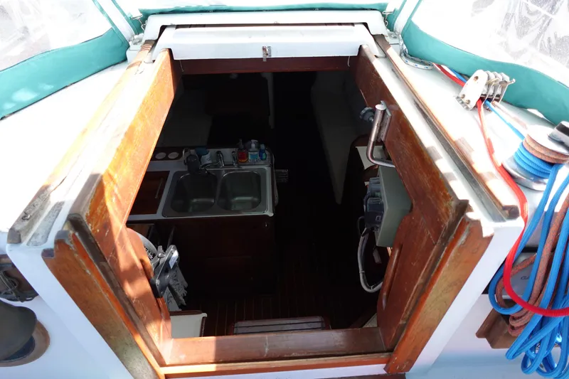 Slide: The Image of 1978 Morgan 382 yacht interior view with kitchen sink and wooden hatch. - 70