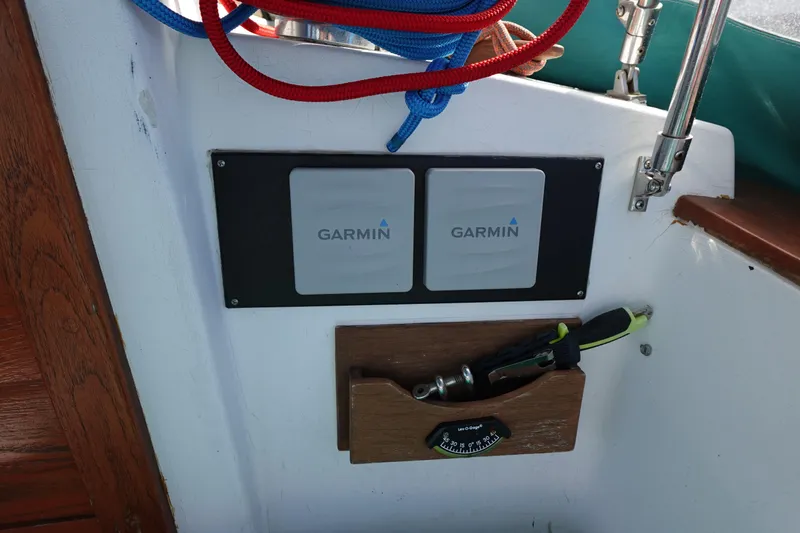 Slide: The Image of Garmin navigation equipment on 1978 Morgan 382 sailboat with ropes and tools. - 72
