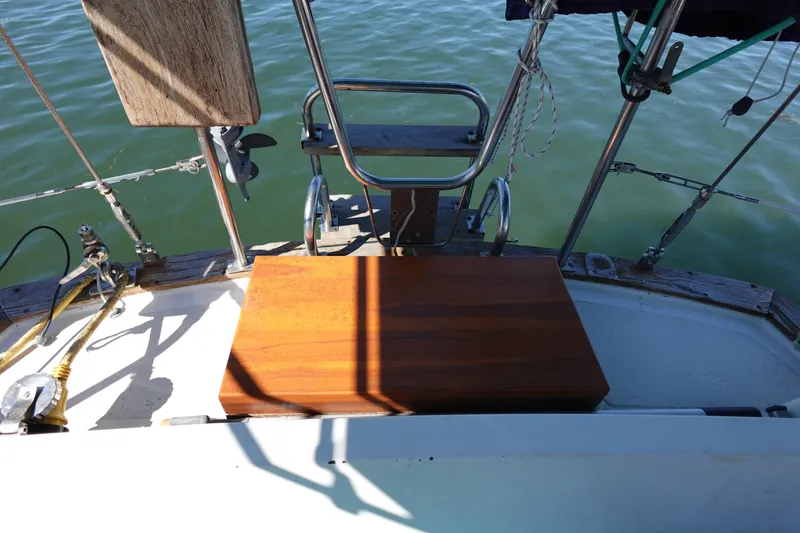Slide: The Image of Cockpit of 1978 Morgan 382 sailboat with wooden seat and nautical equipment. - 82