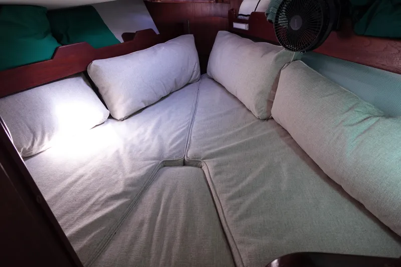 Slide: The Image of Cozy cabin interior of 1978 Morgan 382 sailboat with cushioned bedding. - 19