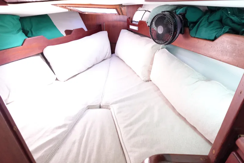 Slide: The Image of Cozy cabin interior of 1978 Morgan 382 sailboat with cushions and fan. - 20