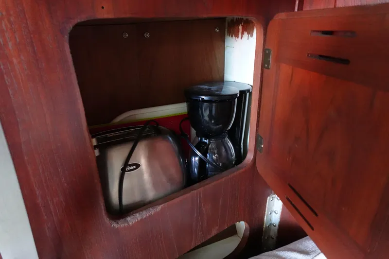 Slide: The Image of Wooden cabinet in 1978 Morgan 382 yacht with coffee maker and toaster inside. - 37