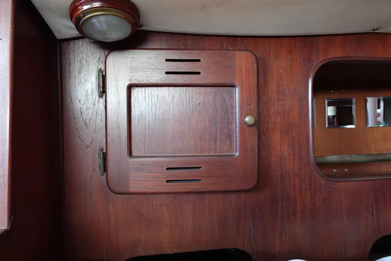Slide: The Image of 1978 Morgan 382 yacht interior with wooden cabinetry and light fixture. - 40