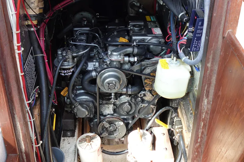 Slide: The Image of Engine compartment of a 1978 Morgan 382 sailboat, showcasing detailed mechanical components. - 45