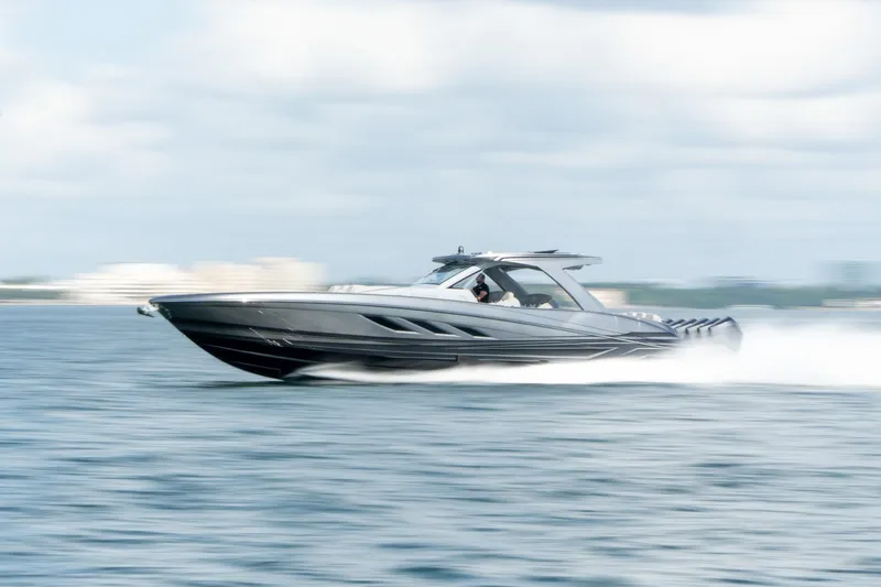 Slide: The Image of 2026 Deep Impact 499 Sport boat speeding on open water, showcasing sleek design and performance. - 11