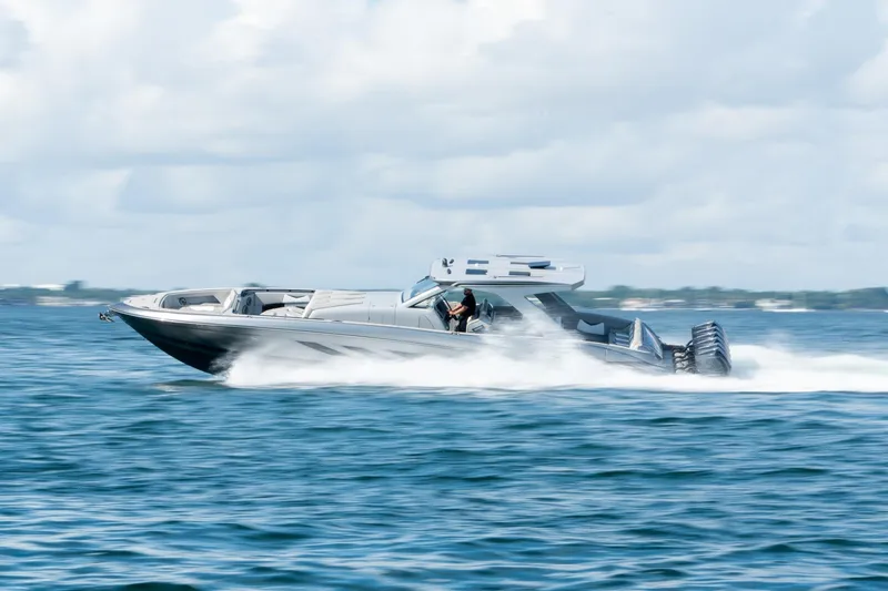 Slide: The Image of 2026 Deep Impact 499 Sport boat speeding on open water. - 14